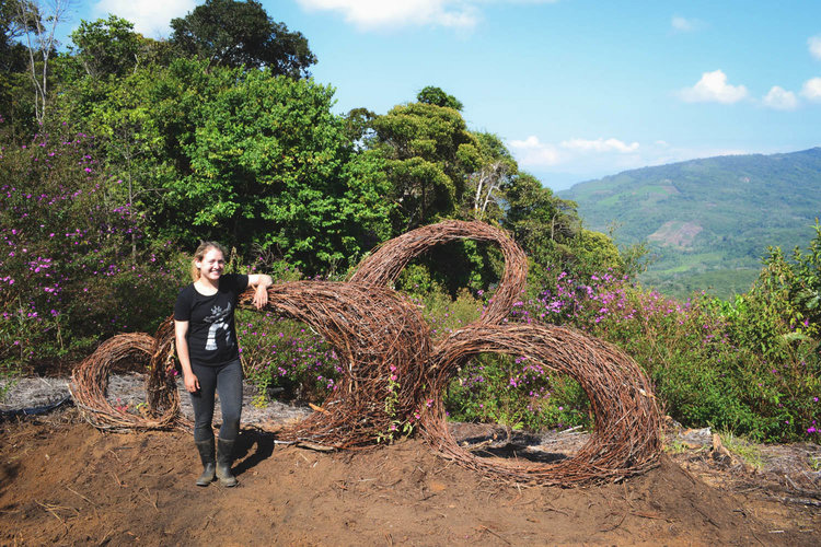 Amy with her sculpture in Peru