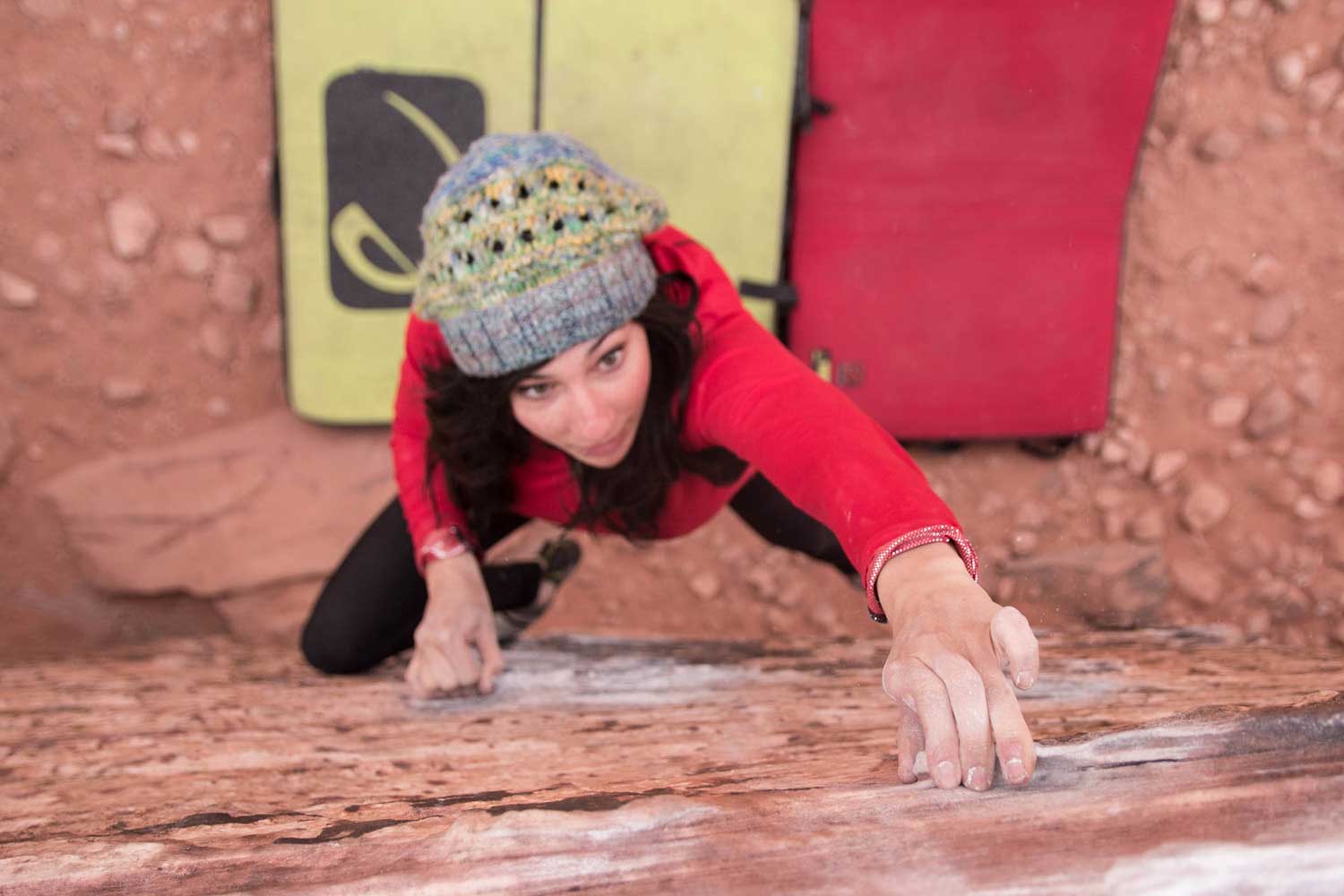 Gabi with her red Organic Climbing crash pad made with CORDURA brand fabric. Photo by Just Go Climb.