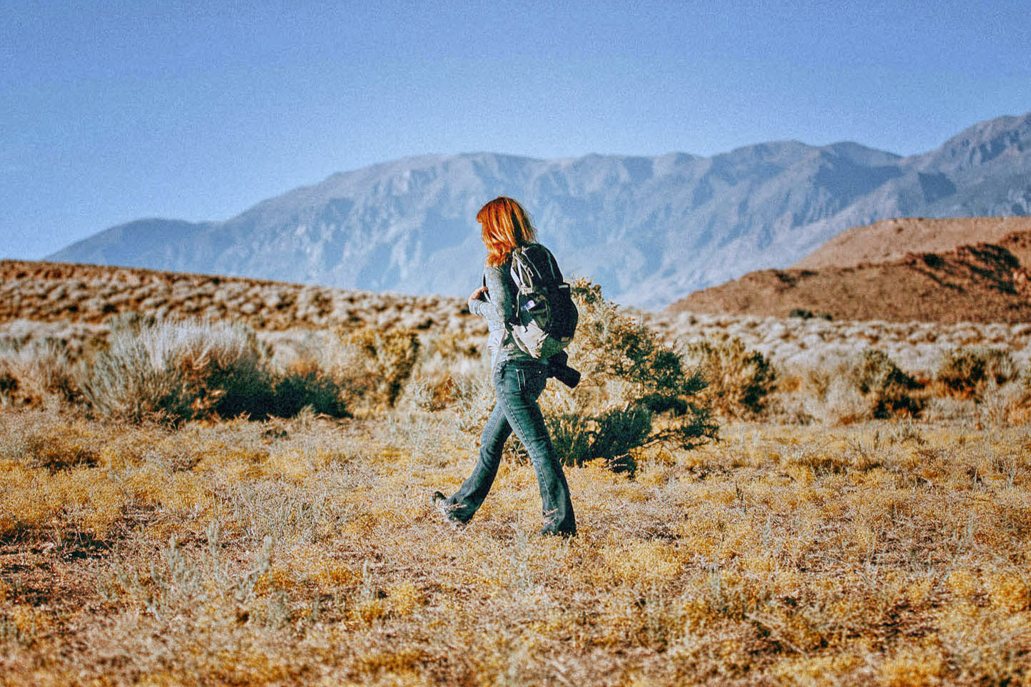 Jean walks through a sagebrush desert