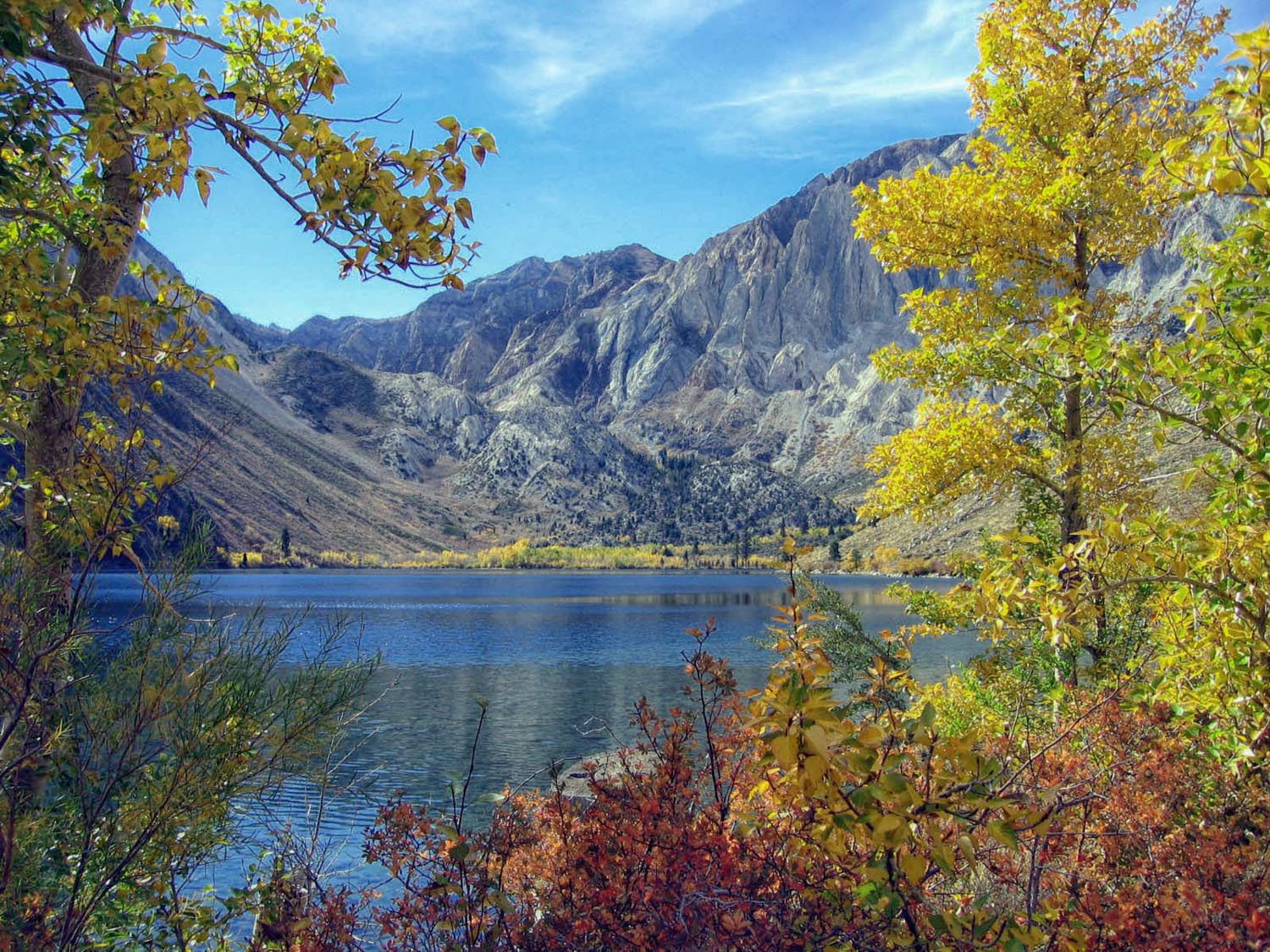 Fall colors at Convict Lake in the Sherwin Range of the Sierras, a calm lake and mountains